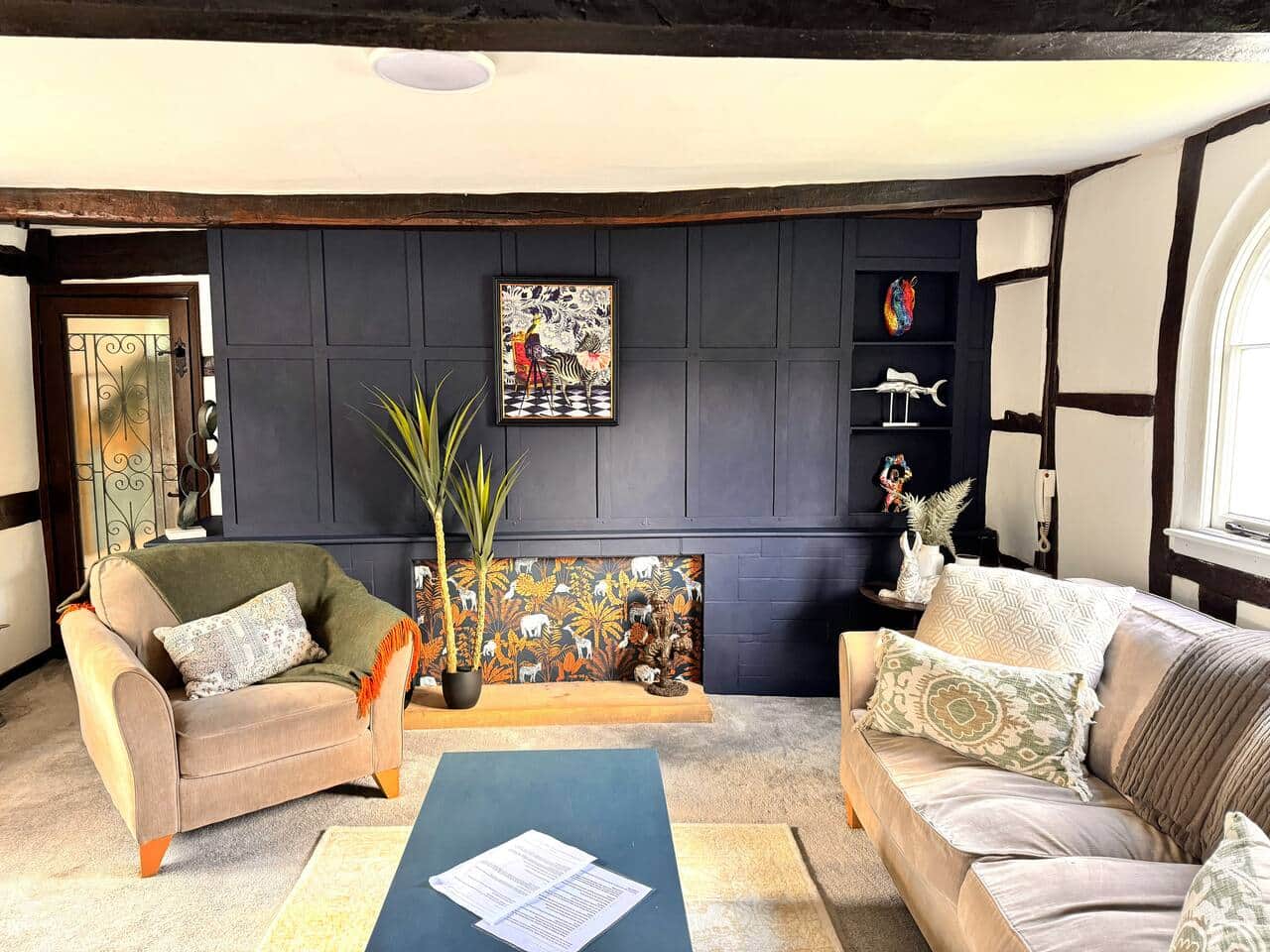 Tudor cottage sitting room with exposed beams