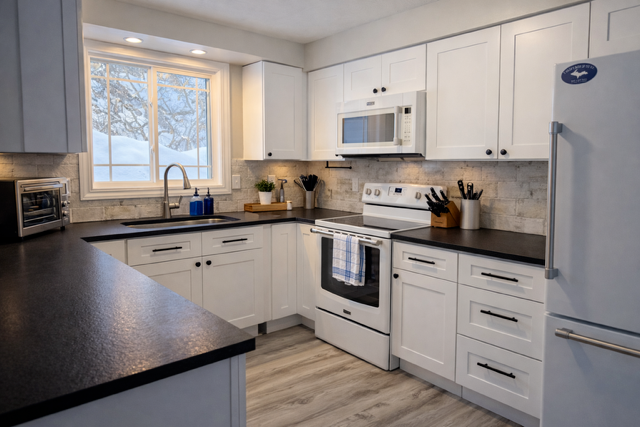 Bright, modern kitchen designed for comfort and convenience during your stay.
