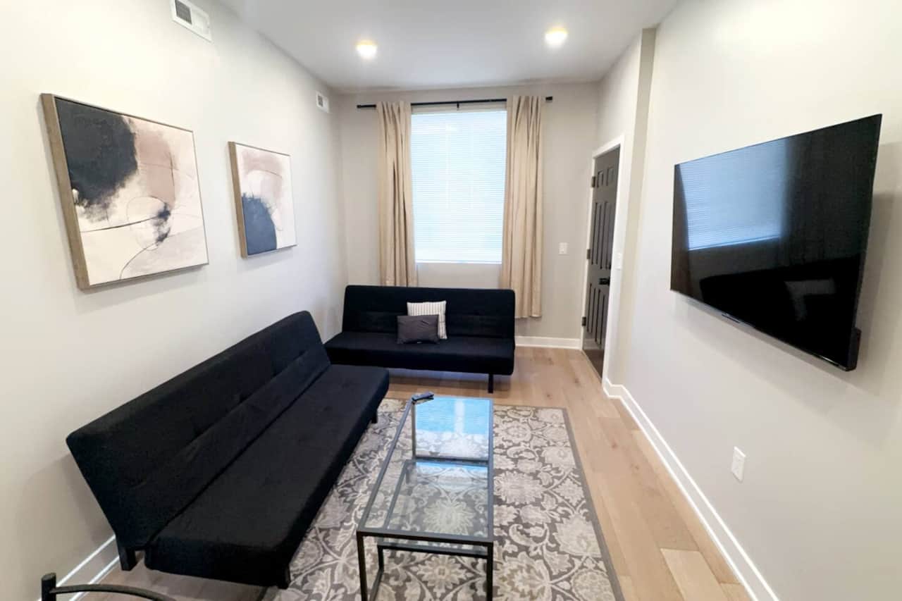 Living room with everything you need for a relaxing stay: a flat-screen TV with Roku channels and high-speed WiFi. Additionally, our living room is equipped with two comfortable sofa beds for extra guests or a cozy night in.
