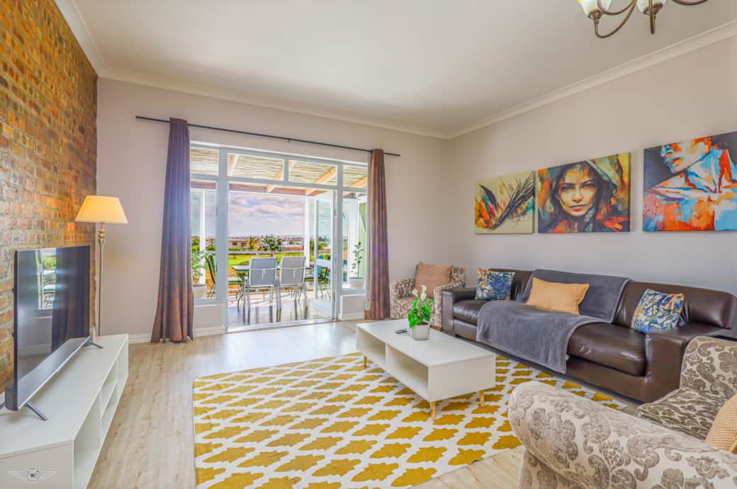 Lounge flowing onto Enclosed Balcony