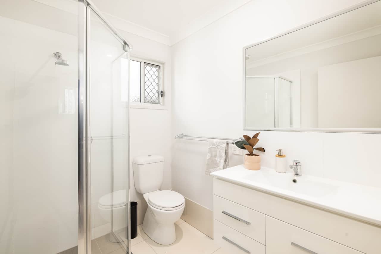 Bathroom: Stylish bathroom with walk-in shower, vanity, and clean finishes 