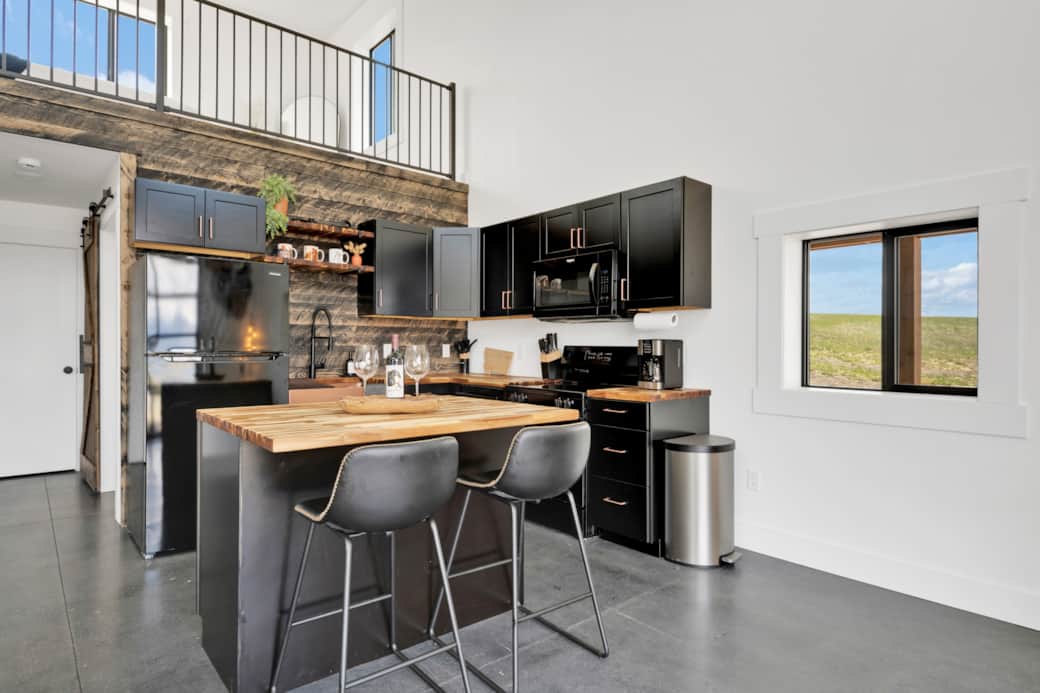 Kitchen provides lots of space for cooking meals at the bunkhouse throughout your stay Kitchen provides lots of space for cooking meals at the bunkhouse throughout your stay