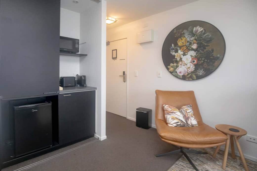 Kitchenette stocked with a Nespresso machine, microwave, toaster, and jug—ideal for a quick bite or morning coffee.