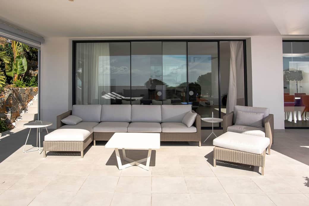 Outside sofa and chair under terrace Outside sofa and chair under terrace
