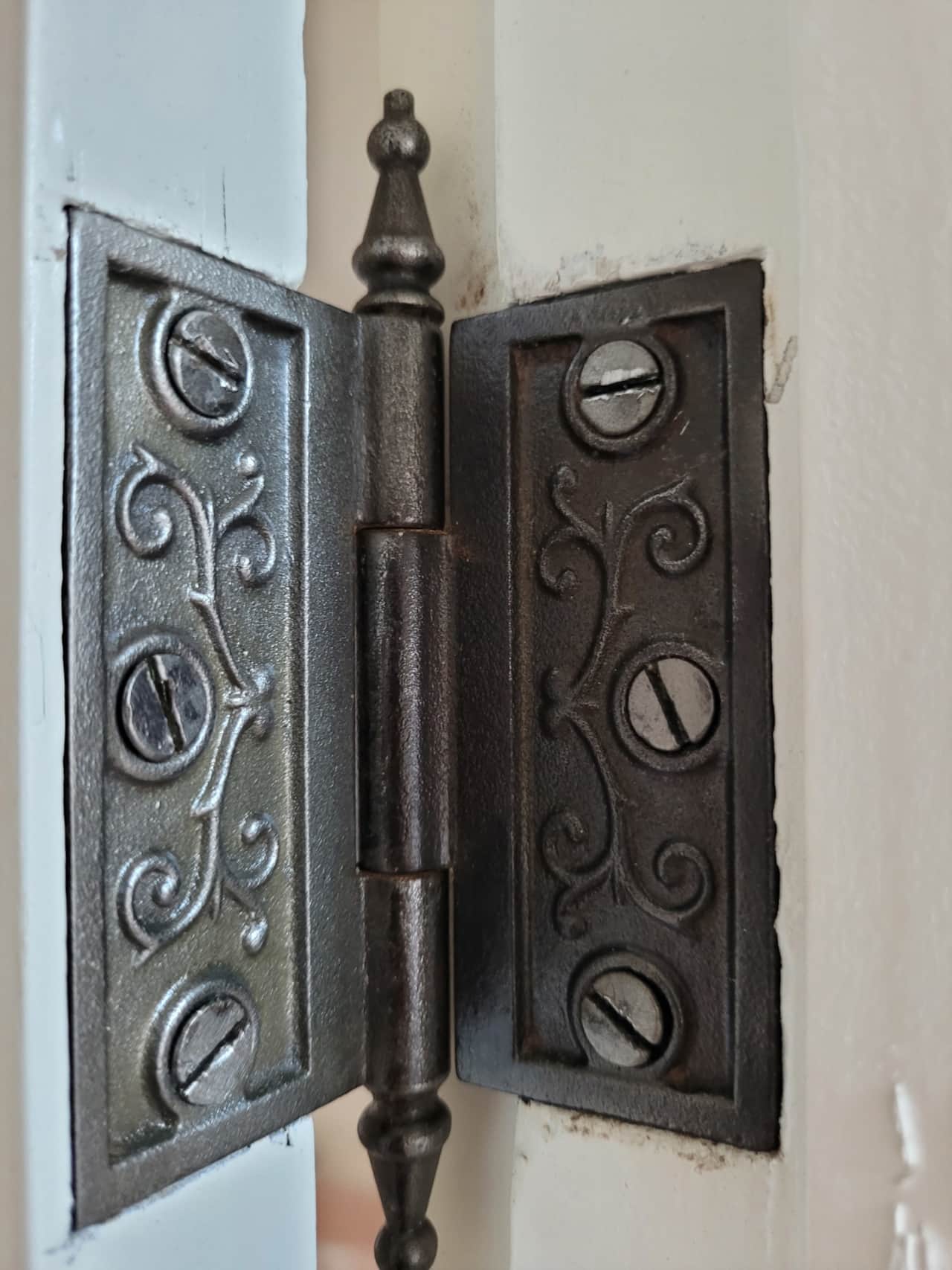 One of the restored door hinges