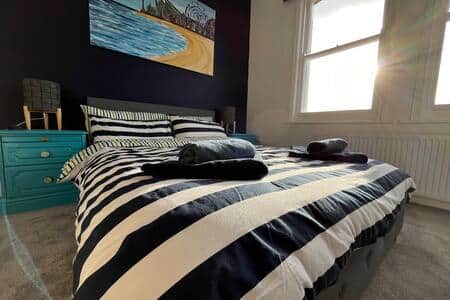 Two large windows fill the Master Bedroom with sunlight