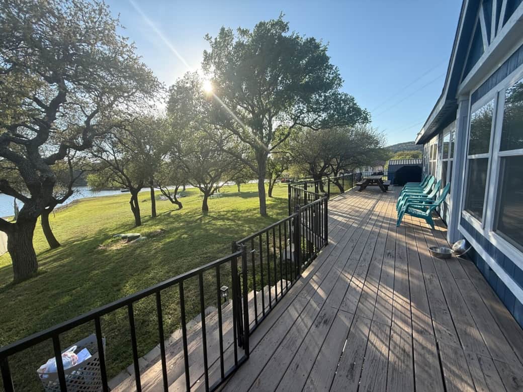 Large deck facing the lake. Over 1 acre of lakefront property. 