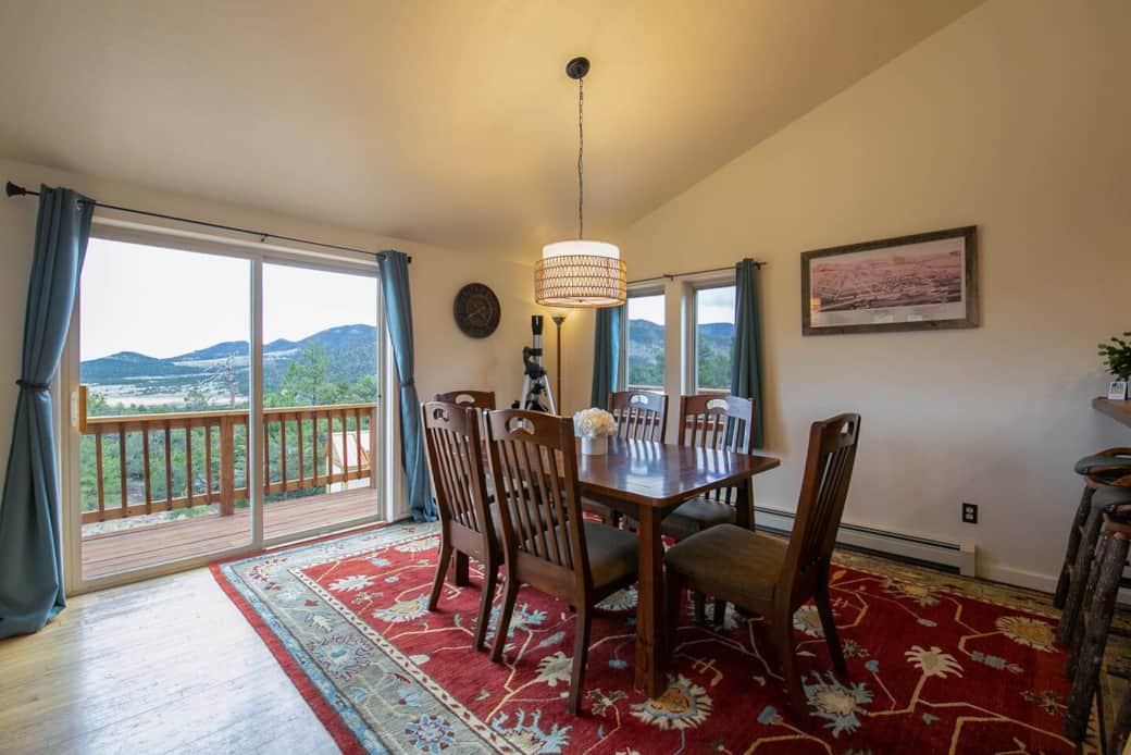 Dining area. Dining table with panoramic mountain and sunset views.