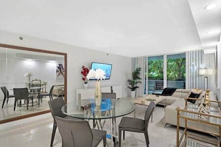 Dining area, living area with patio access and Roku streaming tv