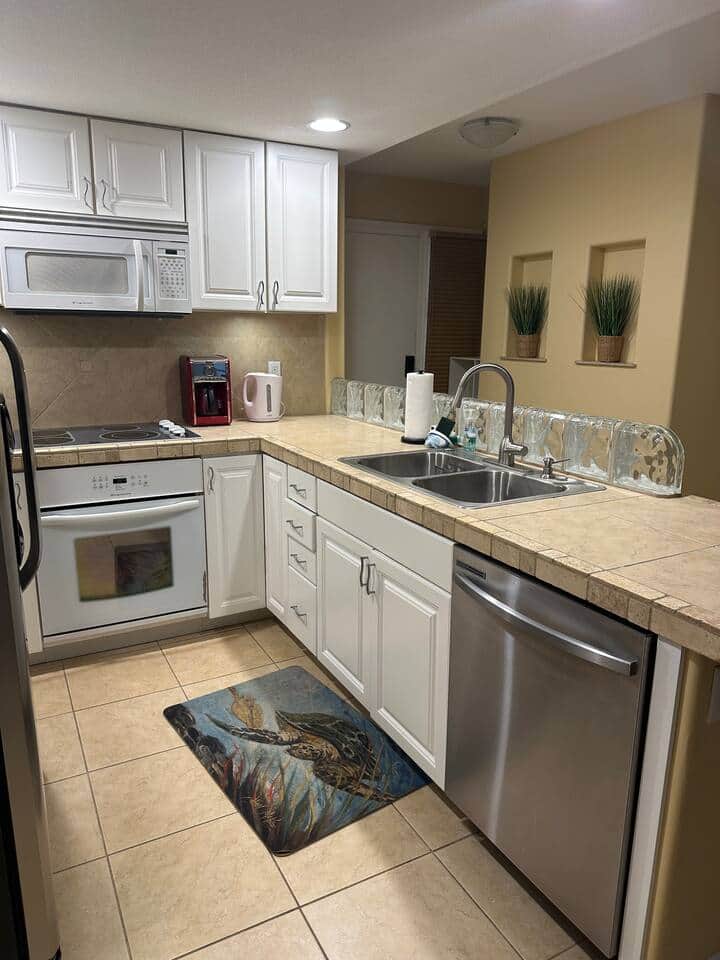 Plenty of counter space with a double stainless sink, garbage disposal and full size dishwasher.