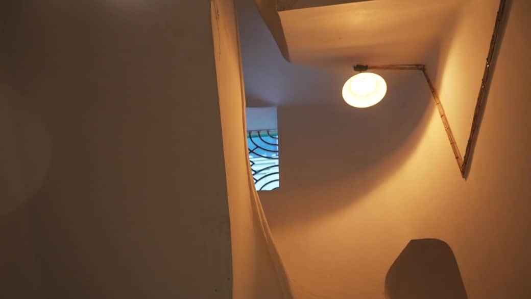 The stairway winds upward, promising comfort, stories, and heritage