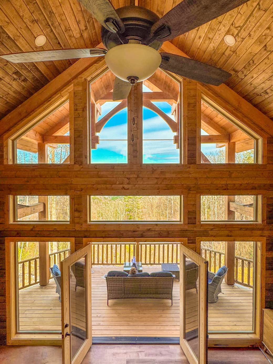 Immersive great room with floor-to-ceiling glass walls showcasing breathtaking mountain vistas