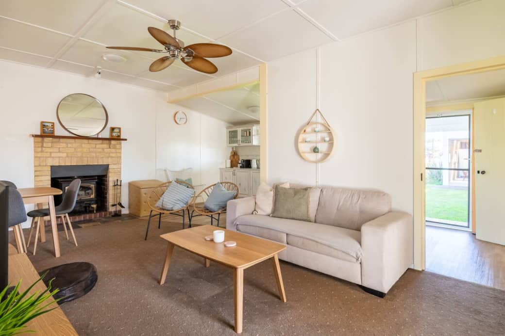 Kitchen is located behind the living and dining area - with access out to massive backyard and outdoor entertaining deck. 