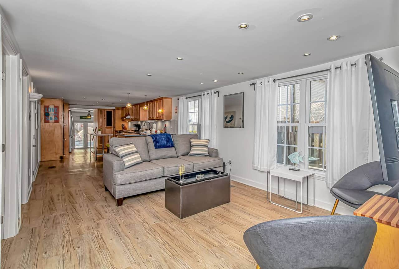 Spacious downstairs living room with open-concept layout