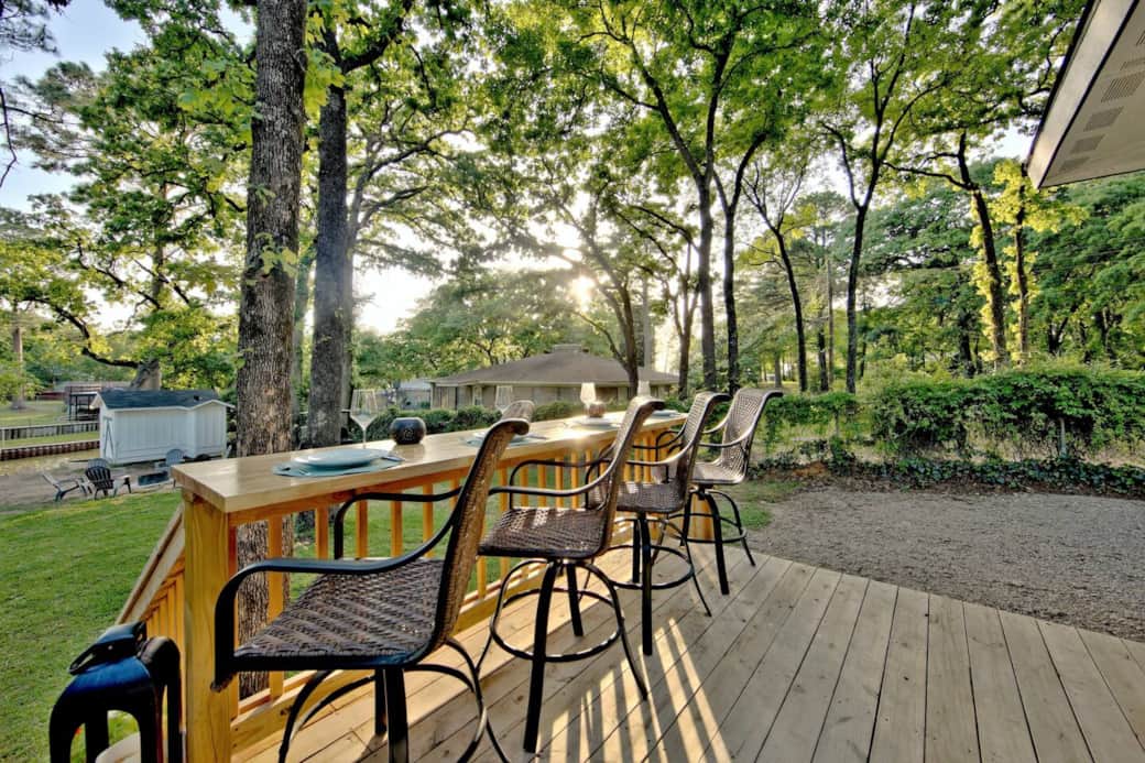 Dine al fresco on the back deck overlooking the backyard and canal.