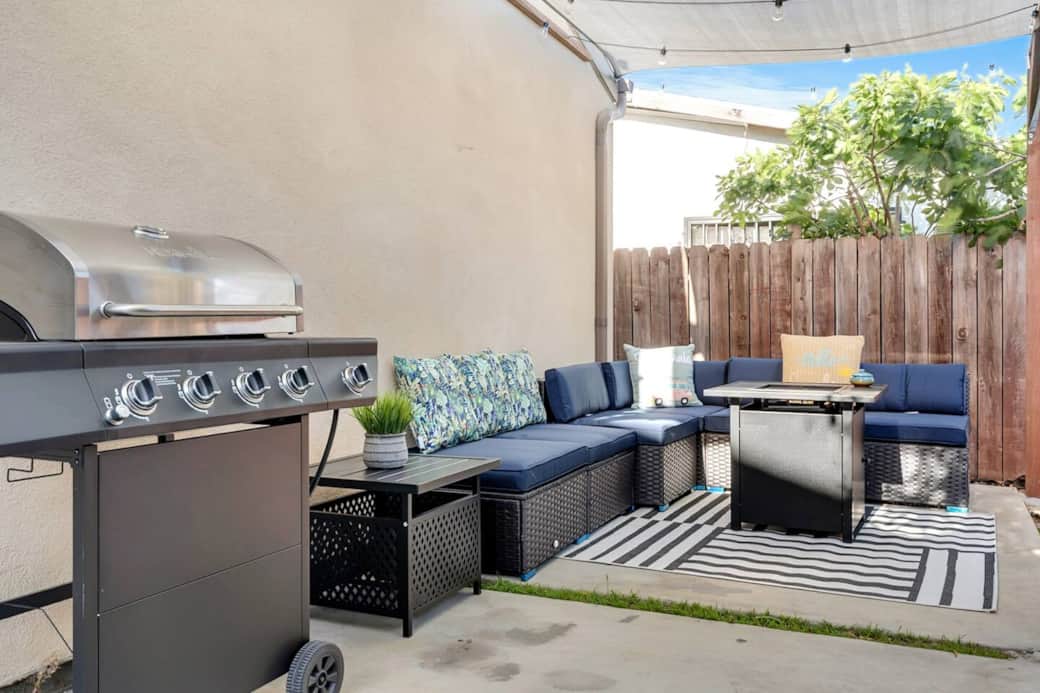 Private Outdoor Patio: Comfortable sectional with a propane fire pit and propane bbq grill Private Outdoor Patio: Comfortable sectional with a propane fire pit and propane bbq grill