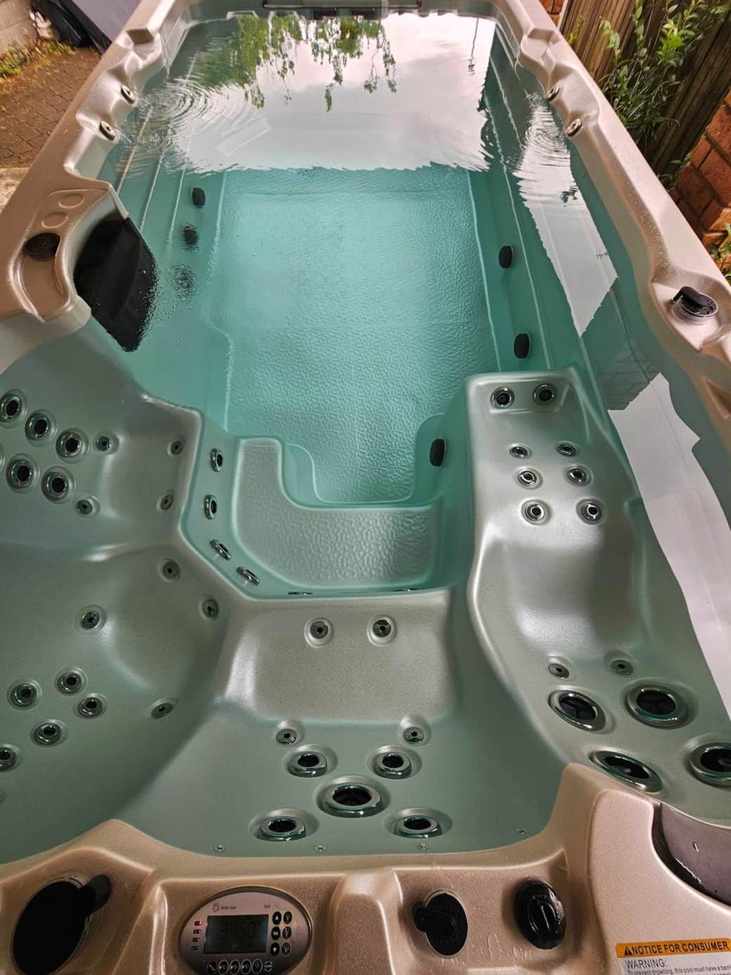 Unwind in your very own private heated swim spa. Whether you're enjoying the powerful hydrotherapy jets in the seated zones or using the central lane for a light swim or aqua stretch, this space is designed for comfort and rejuvenation. 