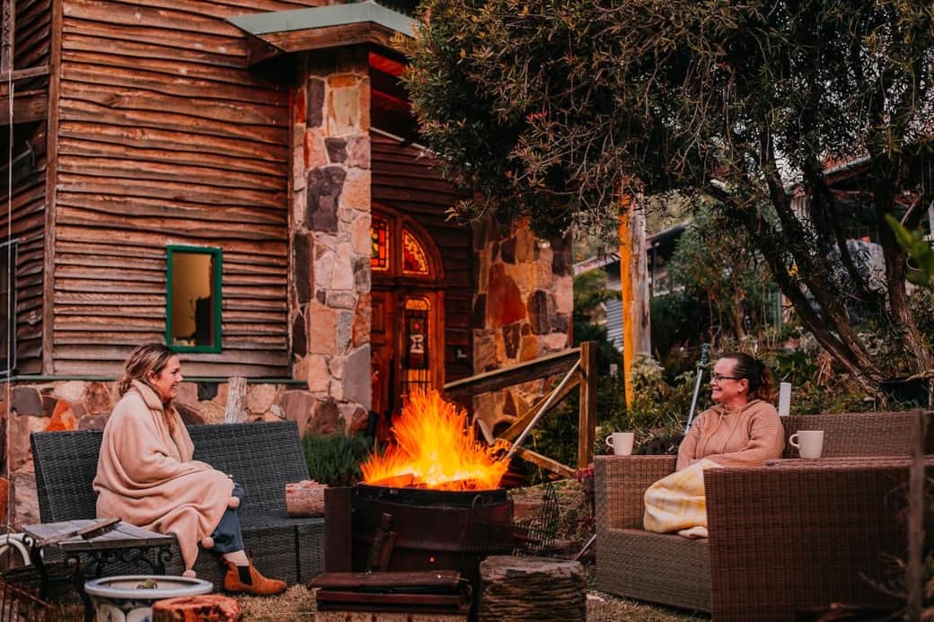 Gather ’round the fire—share stories, laughter, and warm drinks under the alpine sky.