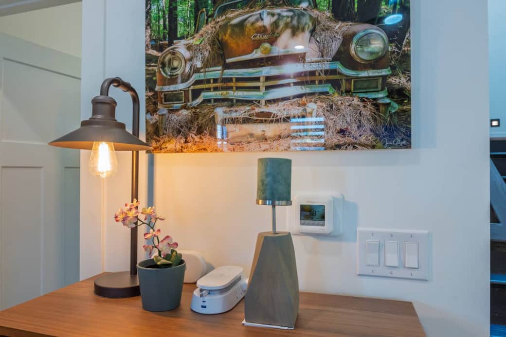 Form meets function - original artwork paired with a convenient charging hub with built-in retractable cables.