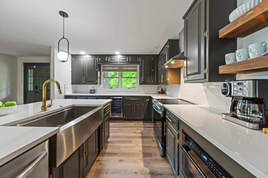 Chef-ready kitchen: SS appliances, Caraway cookware, wine fridge, coffee bar & island seating.