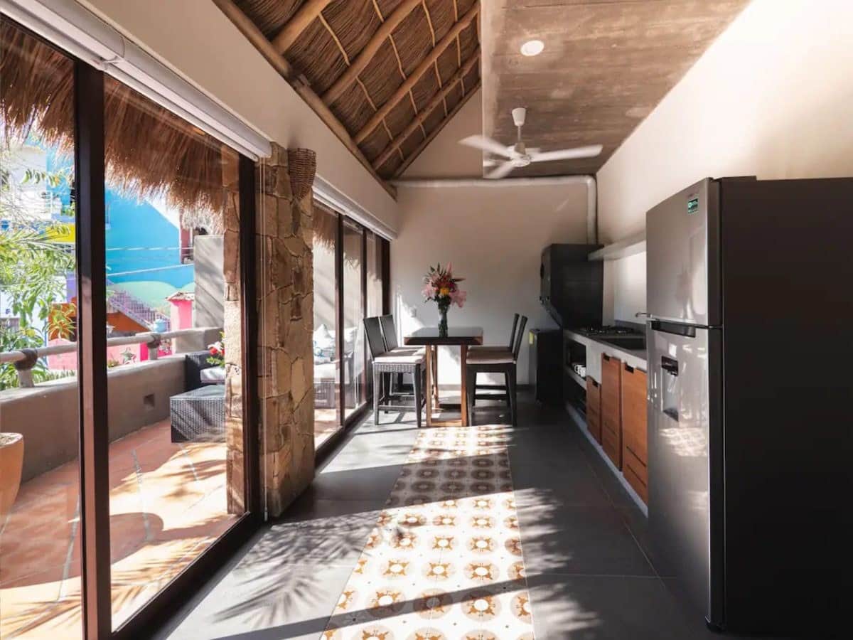 Upper kitchen opening to the terrace
