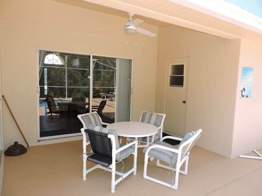 Covered lanai provides shade for your outside dining
