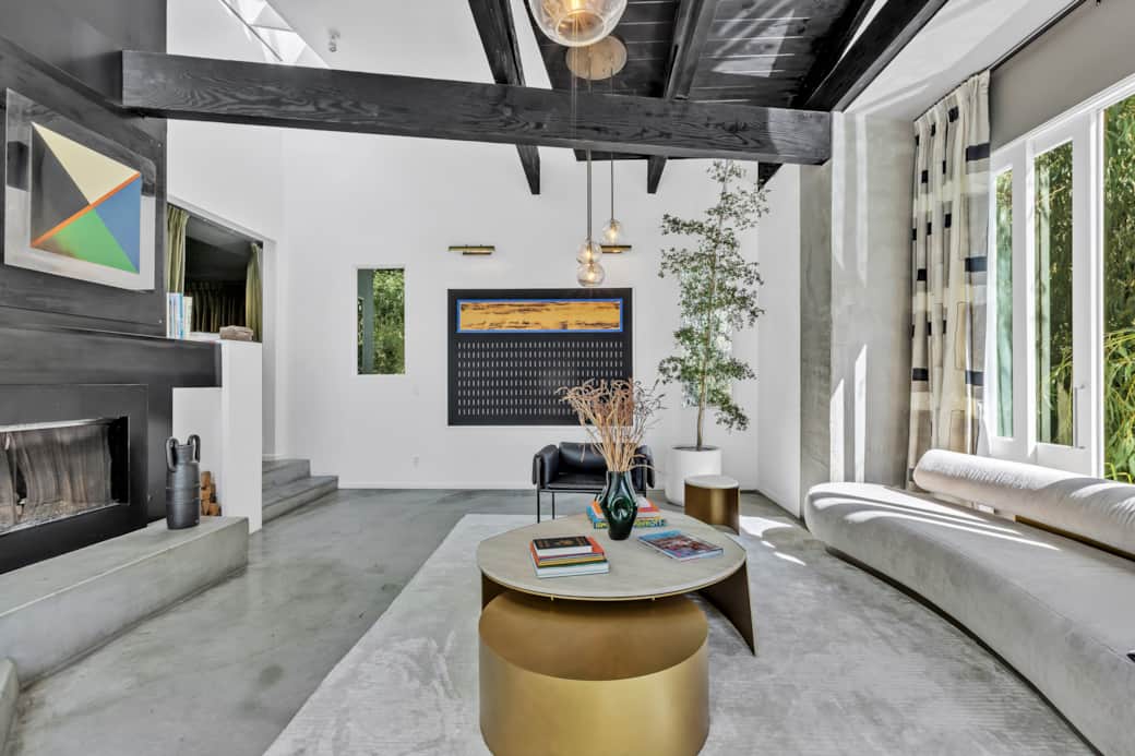 Experience the charm of our airy living room, where style meets comfort in a tranquil setting.
