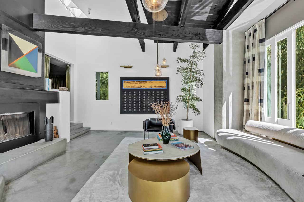Experience the charm of our airy living room, where style meets comfort in a tranquil setting.