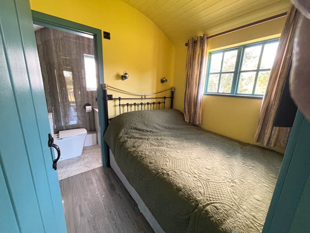 Bright cosy bedroom with ensuite and countryside views.
