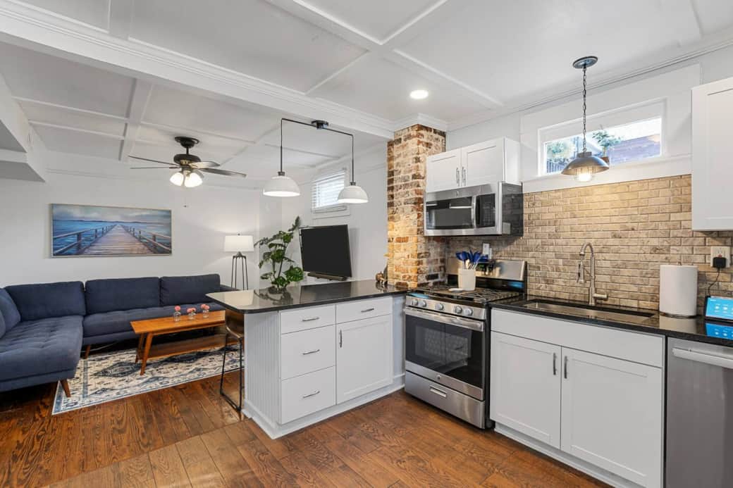 Kitchen view looking into the living room area. Take note of the beautiful Wainscoting Ceiling details can be found in the kitchen, living room, and all three bedrooms.  
