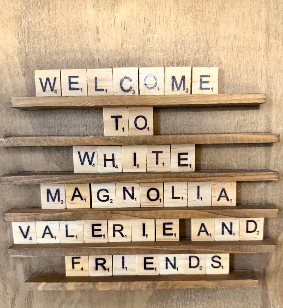 Custom Scrabble tile welcome sign that reads Welcome to White Magnolia Valerie and Friends