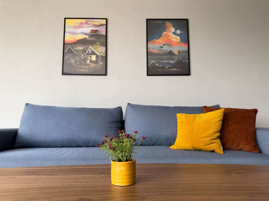 The comfortable and stylish sofa bed in the living room can sleep two people downstairs