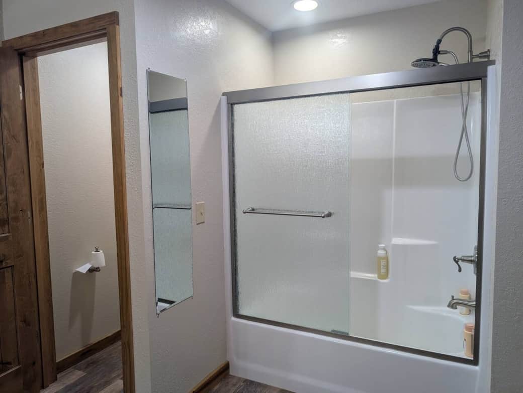 Tub/Shower combo with shampoo, conditioner and body wash. 