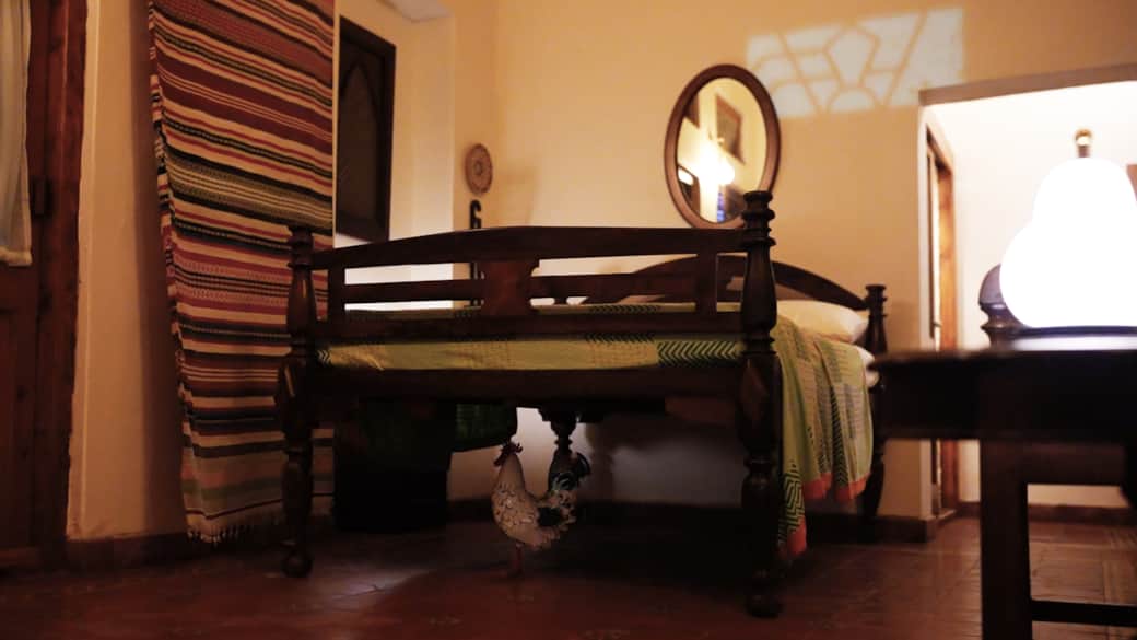 A quiet keeper beneath your bed of dreams