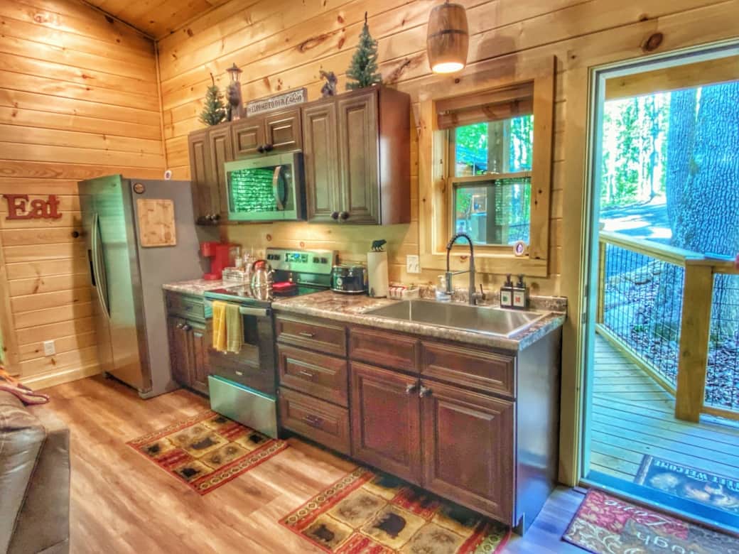 Full size kitchen with everything you need for cooking. Pots, pans, dinnerware, utensils, dish soap, garbage bags(2-3), and paper towels(2) We also provide k cups regular(5-6) and decaf (4) tea bags, syrups, and reg ground coffee. Full size kitchen with everything you need for cooking. Pots, pans, dinnerware, utensils, dish soap, garbage bags(2-3), and paper towels(2) We also provide k cups regular(5-6) and decaf (4) tea bags, syrups, and reg ground coffee.