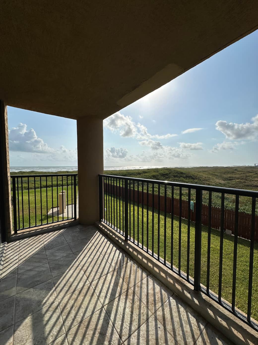 Balcony overlooking the beach, the sand dunes covered with vegetation; Space X is off to the South Balcony overlooking the beach, the sand dunes covered with vegetation; Space X is off to the South