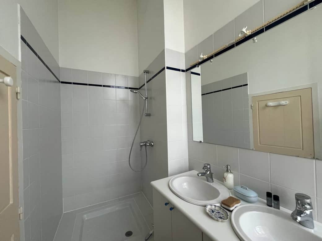 Spacious bathrooms with baths and showers 