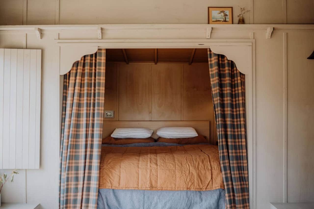 Sink into the generous King Bed complete with Carlotta and Gee flax linen and a little step to help you in.