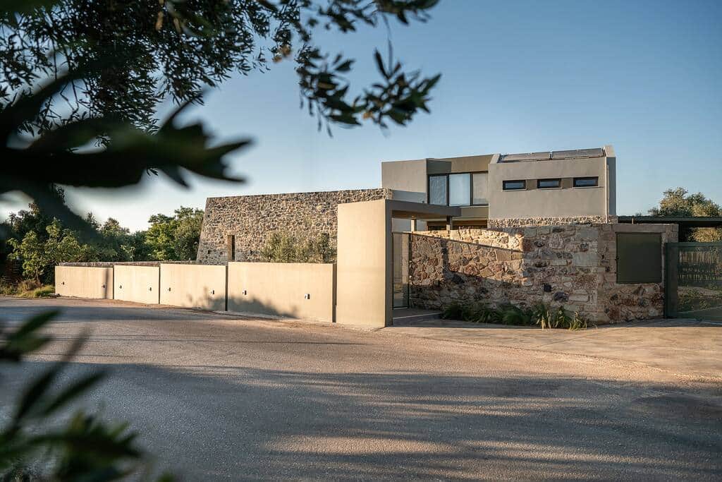From the front street - modern acrhitectural elements combine with the imposing old stone walls