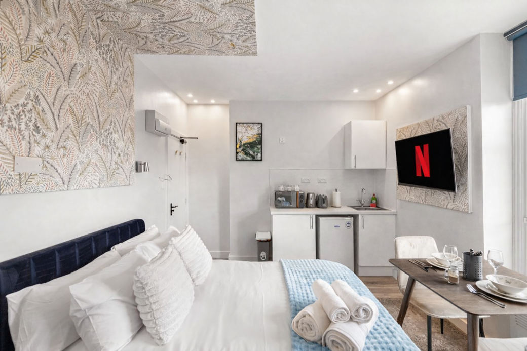 right and stylish bedroom featuring a plush double bed with luxury linens, right and stylish bedroom featuring a plush double bed with luxury linens,