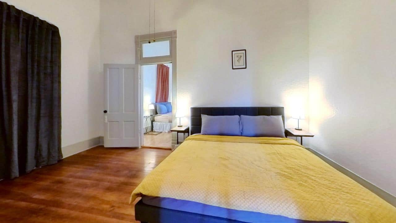 Spacious and inviting bedroom at The Wildflower House, perfect for a restful night’s sleep