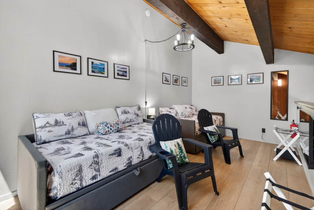 Second loft-style bedroom w/ TV. The day beds can be 2 single beds or 4 single beds (trundle) or 2 kings beds. 