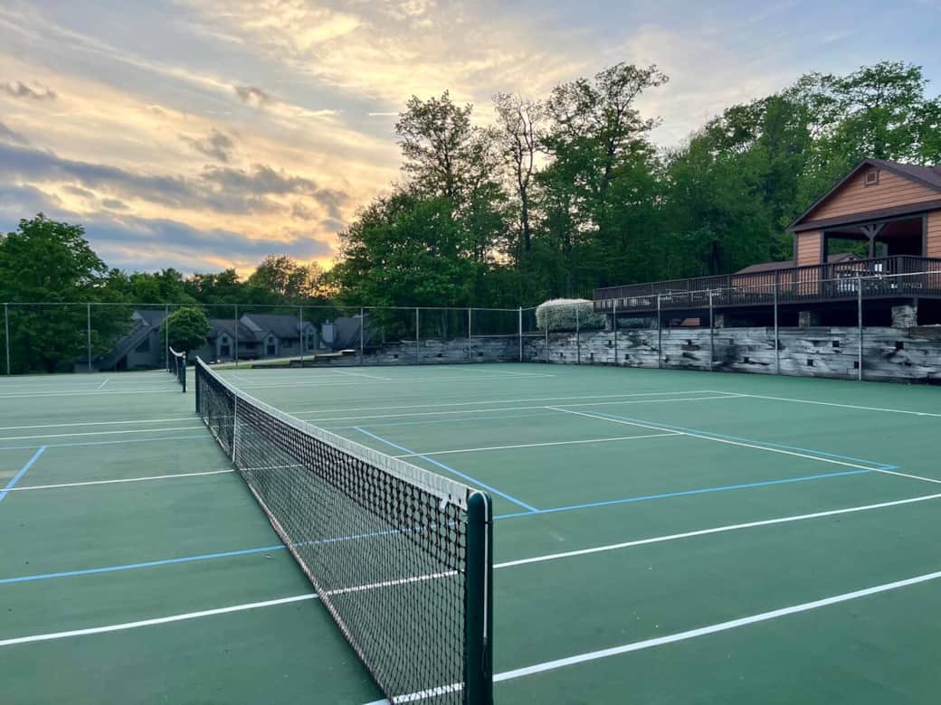 The tennis courts and pickleball courts are right next to the pool. Hop on the court!
