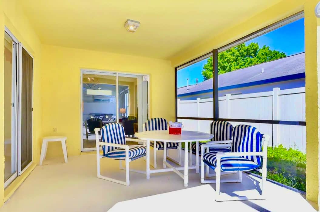 Covered lanai for alfresco dining or to take a respite from the Florida sunshine
