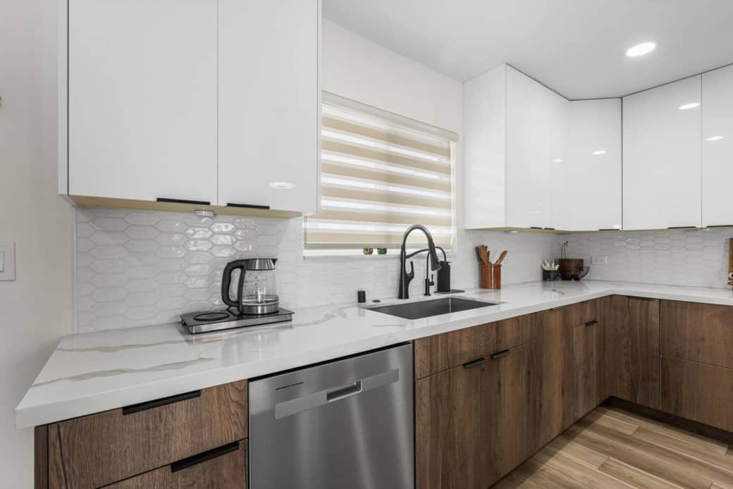Enjoy a modern kitchen with quartz counters stainless appliances and plenty of space to prep meals.