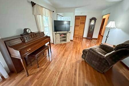 Real solid oak flooring.  Fresh white paint.