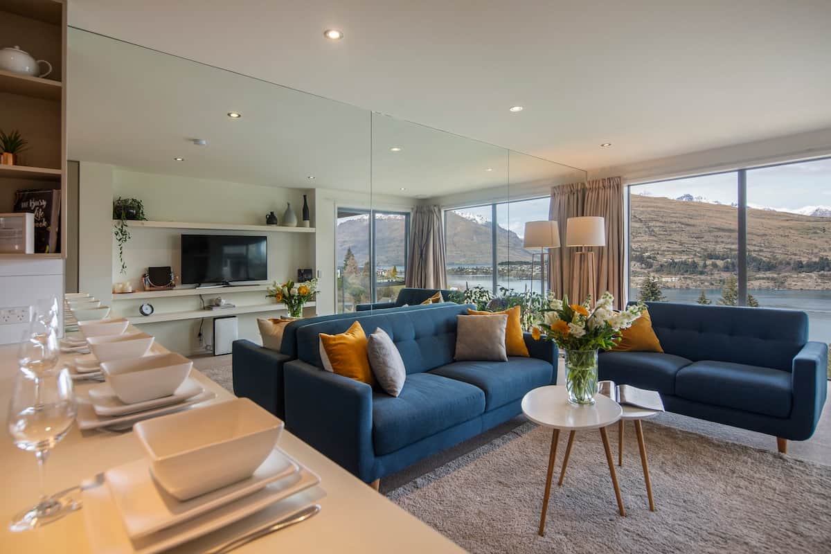 Lounge with full mirror wall to maximise light and views