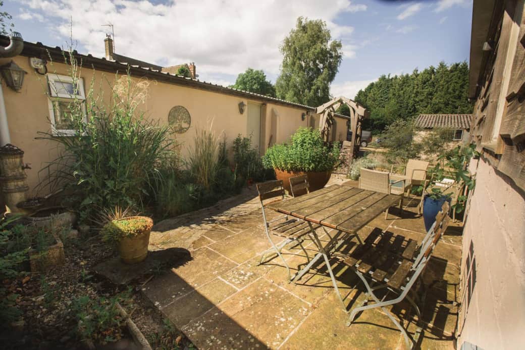 The Cowshed is on the left and the garden is just for the use of Airbnb guests. Note the big steel bowl in the middle full of herbs for the use of the guests too.