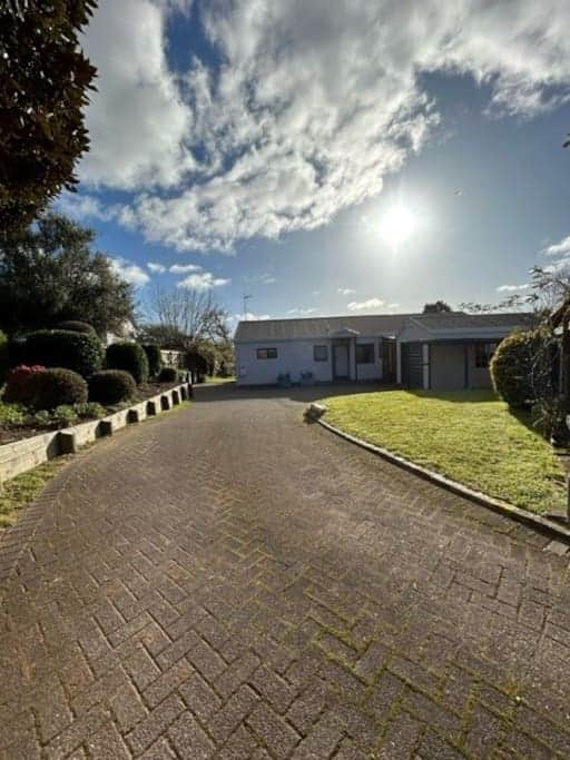The driveway offers comfortable parking for up to 3 cars.