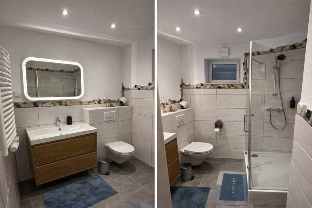 Helles Badezimmer mit Dusche, Waschbecken und stilvollen Details Helles Badezimmer mit Dusche, Waschbecken und stilvollen Details